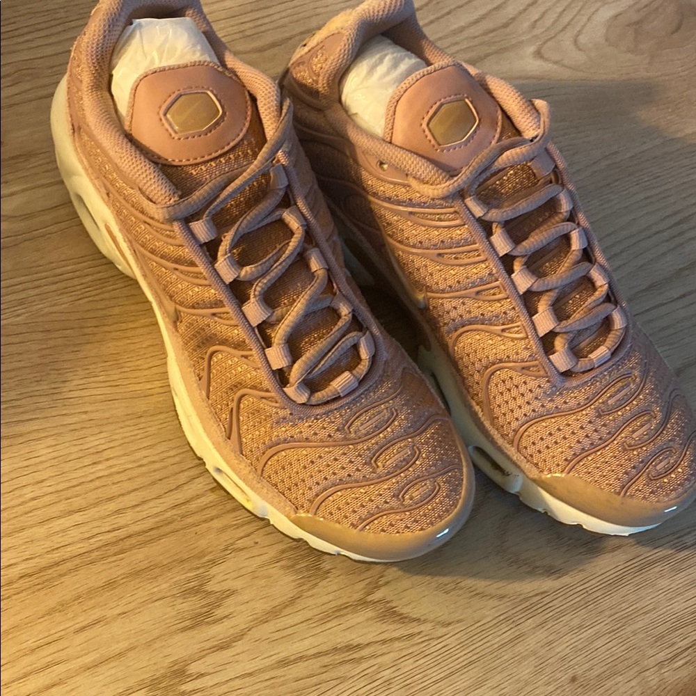 Gold rose Nike sneakers with Ribbed Texture and White Sole. Too cute..